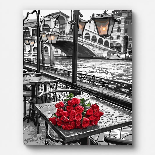 Terrasse mit roten Rosen – Malen nach Zahlen auf gespannter Leinwand